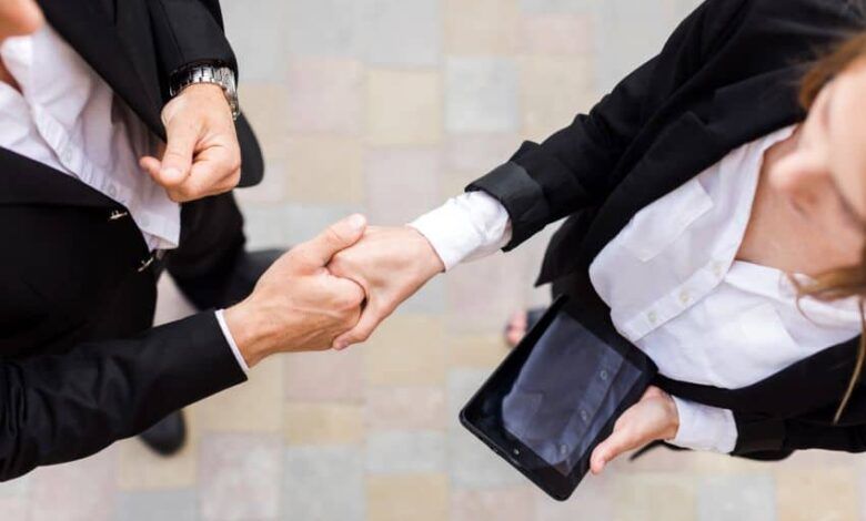 Business people shaking their hands.jpg