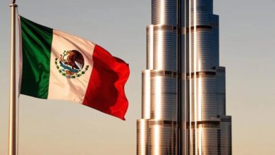 The burj al khalifa in dubai with a mexican flag flying in the foreground.jpg