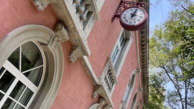 Original facade in original salmon color with original red clock from 1960s.jpg